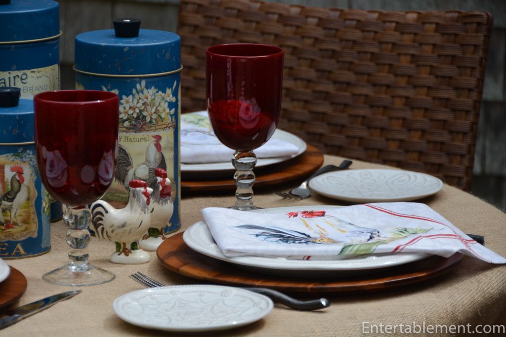 table with red glasses and rooster theme