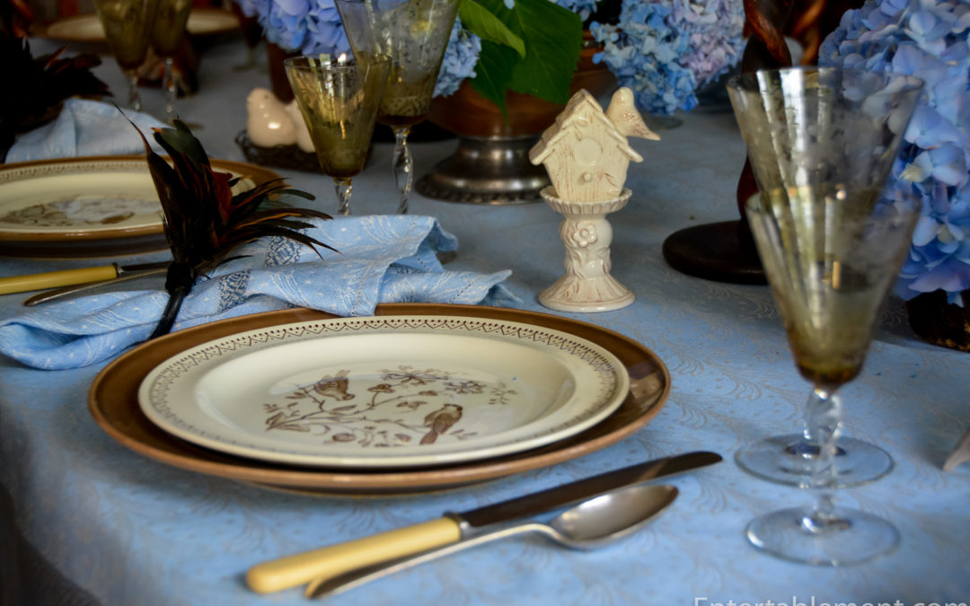 A Blue & Brown Table with Williamsburg Wedgwood Aviary